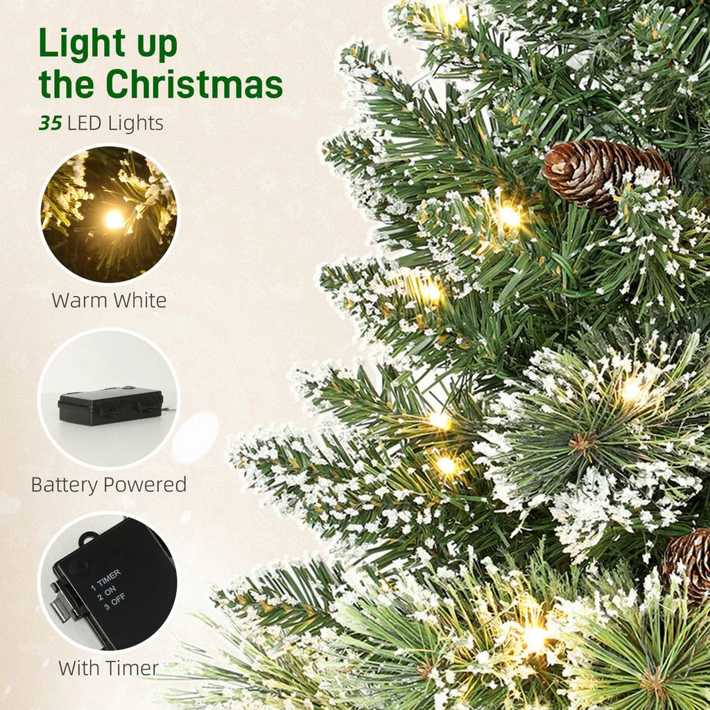 60 cm Prelit Small Christmas Tree, Snow Flocked Tabletop Mini Xmas Tree with 35 LED Lights, Pine Cones and Linen Cover Base, Battery Operated, Green